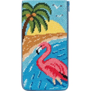 May include: A pink flamingo stands in blue water with a palm tree and a yellow sunset in the background. The image is a needlepoint design.