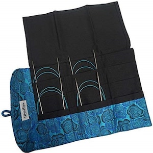 May include: A blue and black fabric roll-up case with a floral pattern and the word "HiyaHiya" printed on the side. The case is open to reveal eight pairs of circular knitting needles.