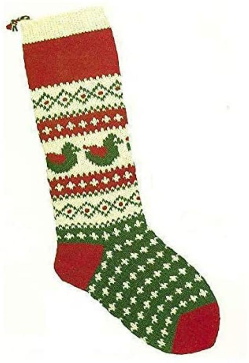 May include: A red and green Christmas stocking with a white and green geometric pattern and a red cuff. The stocking features a repeating pattern of birds.