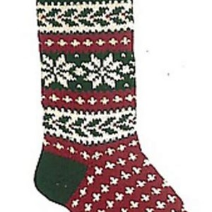 May include: A red and green knitted Christmas stocking with a white snowflake pattern. The stocking has a green cuff and a green toe.