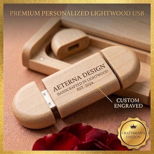 May include: A light-colored wooden USB drive with the text "AETERNA DESIGN HANDCRAFTED IN LIGHTWOOD EST. 2024" and "CUSTOM ENGRAVED". The USB drive is in a wooden case with a Craftsman's Edition seal.