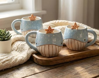 Blauwal-Tasse, handbemalt mit Seesternanhänger, Küstendekor