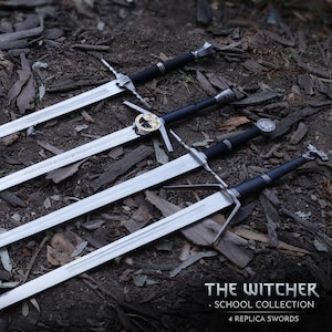 May include: Four metal replica swords from The Witcher School Collection, each featuring a long silver blade, a black grip, and a unique pommel design. The swords are arranged diagonally, showcasing distinct crossguards and metallic detailing.