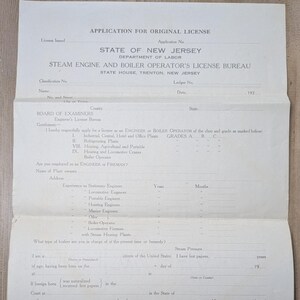 May include: Vintage application form for an original license from the State of New Jersey's Department of Labor, Steam Engine and Boiler Operator's License Bureau. The document is aged, with visible creases and text, including sections for personal information and experience.