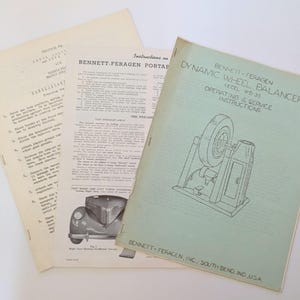 May include: Vintage Bennett-Feragen Dynamic Wheel Balancer Model WB-35 operating and service instructions booklet with loose pages. The cover is light green with a line drawing of the balancer. The loose pages are off-white.