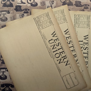 May include: Three vintage Western Union telegram forms with the text "Charge to the account of" and "Send the following telegram subject to the terms on back hereof, which are hereby agreed to" printed on them.
