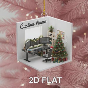 May include: A 2D flat Christmas ornament featuring a miniature office scene. The ornament includes a desk with three computer monitors, a keyboard, and a Santa hat on the chair. The text "Custom Name" and "2D FLAT" are visible.
