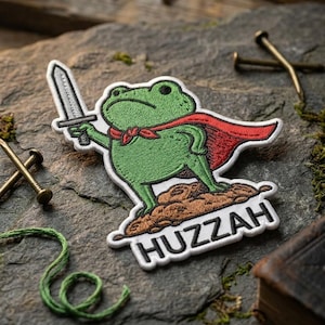 May include: A white ceramic mug with a black handle and the text "But First, Coffee" in a black, handwritten-style font. The mug is on a white surface.