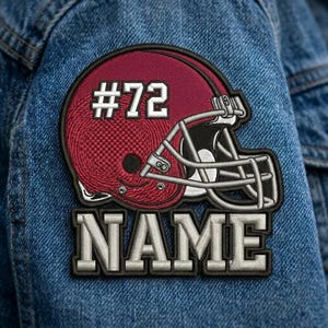 May include: Embroidered patch featuring a maroon football helmet with the number "72" in white. Below the helmet, the word "NAME" is displayed in a bold, silver font. The patch is set against a blue denim background.