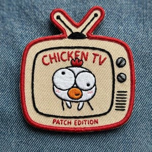 May include: Embroidered patch featuring a cartoon chicken inside a retro TV set. The TV is beige with a red border and antenna, and the text "CHICKEN TV" is above the chicken. The patch also says "PATCH EDITION".