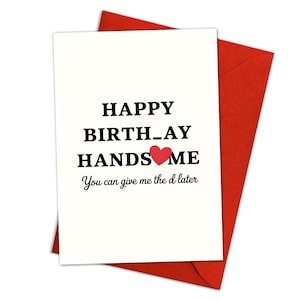 May include: A white birthday card with the text "HAPPY BIRTH_AY HANDSOME" and a red heart. The card is on top of a red envelope. The bottom of the card reads "You can give me the d later".