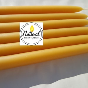 100% pure Beeswax Candle. Beeswax Tapers choose a diameter 3/8", 1/2", 5/8", 3/4", or 7/8". 8" long Dripless. Made in Michigan