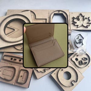 May include: A brown leather wallet with card slots is displayed, surrounded by various wooden die-cut shapes. The wallet is open, showcasing its interior. The wooden shapes include circles, arches, and leaf designs, suggesting a crafting or leatherworking theme.