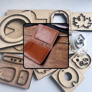 May include: A brown leather wallet with white stitching is open, displaying the interior. Surrounding the wallet are various wooden craft tools and templates, including shapes like a maple leaf and a circle.