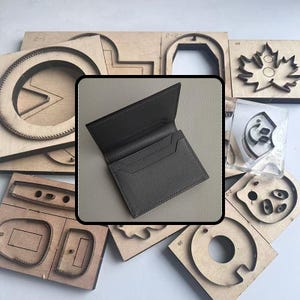 May include: A dark gray leather wallet with multiple card slots is displayed open. Surrounding the wallet are various wooden die-cut shapes, including circles, rectangles, and leaf patterns, likely for leather crafting.