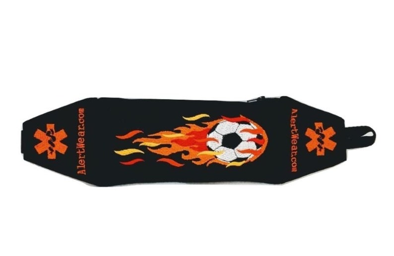 Alert Wear Black Alert Wear Medicine Case with Soccer Ball and Red and Orange Flames. Orange Medical Alert Symbols on sides.