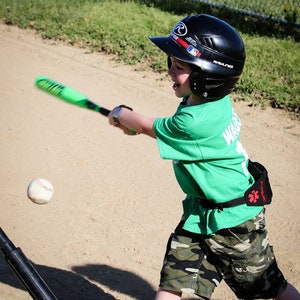 Boy playing baseball wearing his Alert Wear case.