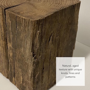 May include: A square-cut block of dark brown wood featuring a visible grain pattern on the top surface and a weathered, textured side. A white square overlay contains the text: Natural, aged texture with unique knots, lines and patterns.