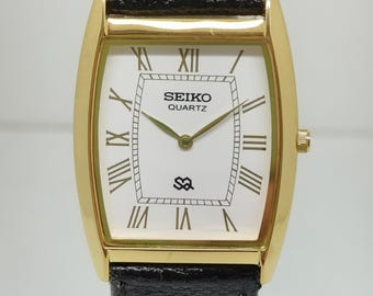 Vintage Seiko unisex Armbanduhr Weißes Quadrat Zifferblatt Japan Quarzwerk