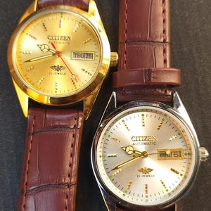 Reloj de pulsera Citizen vintage automático de 21 joyas, restaurado, con esfera blanca y dorada y correa de cuero.