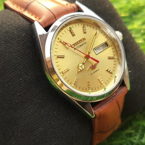 Reloj Citizen automático vintage: esfera dorada, caja chapada en oro, reloj de caballero restaurado.