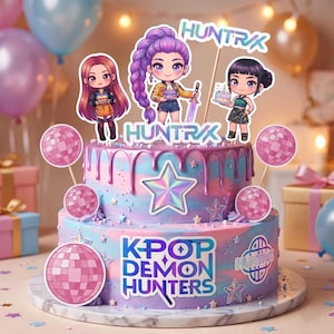 May include: A two-tiered cake with a vibrant design, decorated with stars and disco balls. The cake is topped with three character figurines and the text "HUNTRX". The bottom tier reads "K-POP DEMON HUNTERS".