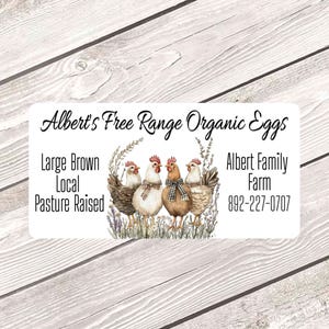 May include: A rectangular label with the text "Albert's Free Range Organic Eggs" and the words "Large Brown Local Pasture Raised." The label features an illustration of four chickens and the text "Albert Family Farm 892-227-0707."