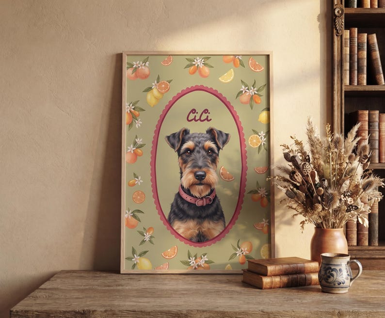 May include: A framed rectangular wall art print featuring a portrait of a black and tan terrier dog wearing a pink collar. The dog is centered within a scalloped oval frame, surrounded by a pattern of oranges, lemons, and white blossoms on a sage green background. The name CiCi is printed in script above the dog.