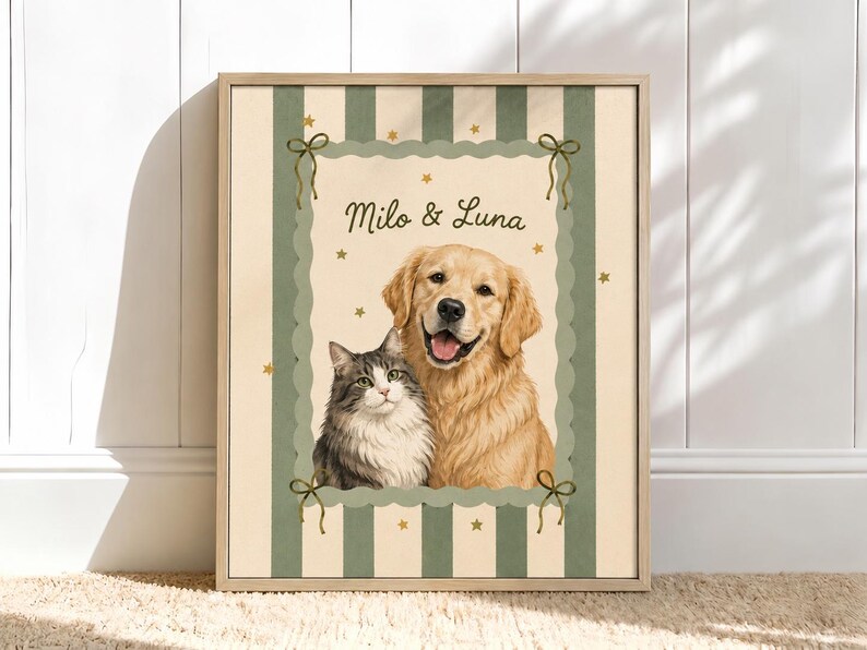May include: A framed wall art print featuring a portrait of a golden retriever and a grey and white tabby cat. The text Milo & Luna is printed above the animals. The background has vertical green stripes, small gold stars, and a scalloped border.