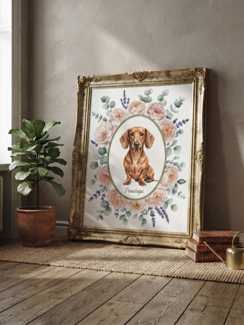 May include: A framed wall art print featuring a brown dachshund centered within an oval frame, surrounded by a watercolor wreath of pink roses, eucalyptus leaves, and purple lavender sprigs, with the name Penelope written below the dog.