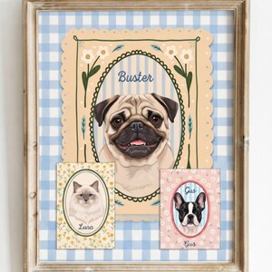 May include: A framed wall art print featuring three pet portraits. A large central pug labeled Buster, a smaller cat portrait labeled Luna, and a French bulldog portrait labeled Gus. The background is a light blue and white gingham pattern.
