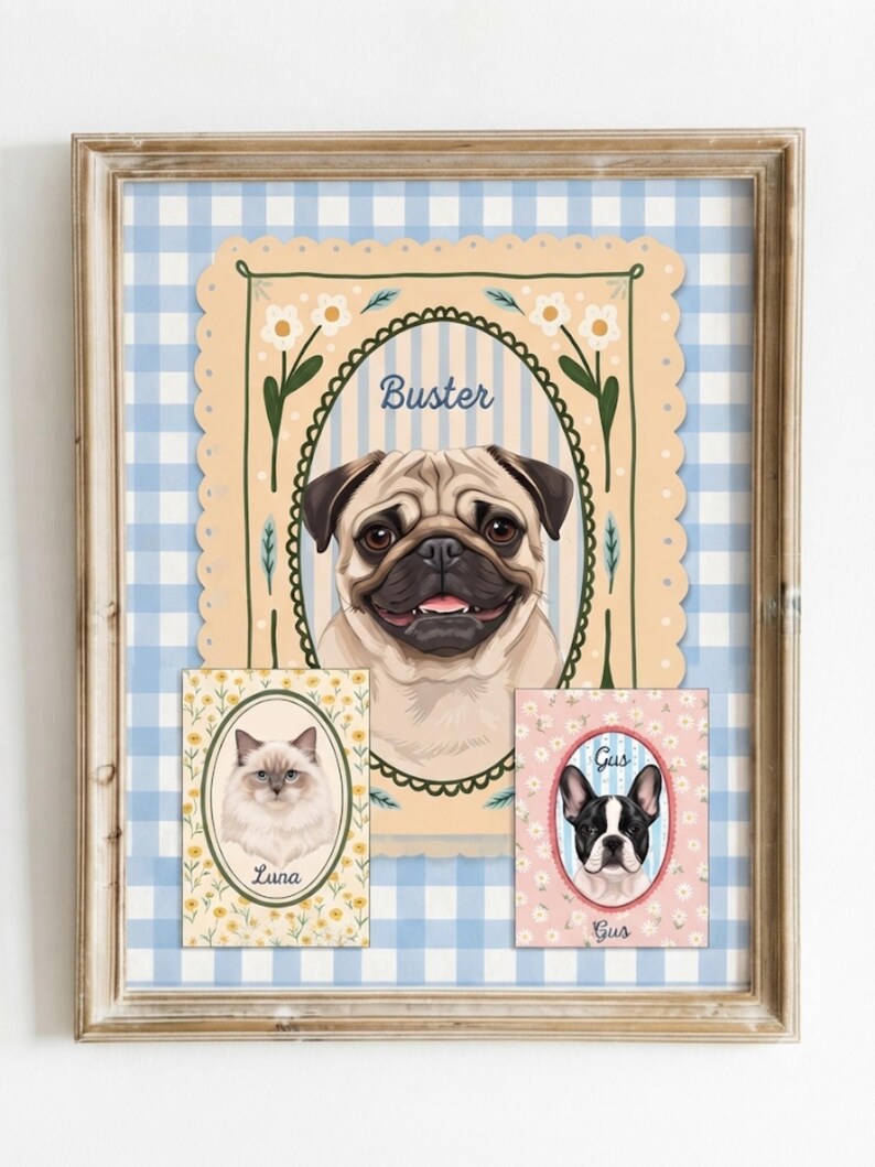 May include: A framed wall art print featuring three pet portraits. A large central pug labeled Buster, a smaller cat portrait labeled Luna, and a French bulldog portrait labeled Gus. The background is a light blue and white gingham pattern.