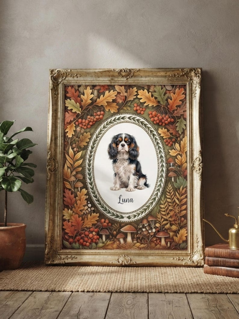 May include: A framed rectangular wall art piece featuring a central oval portrait of a tricolor Cavalier King Charles Spaniel dog. Below the dog, the name Luna is written in script. The border displays autumn leaves, berries, and mushrooms.