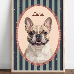 May include: A framed wall art print featuring a portrait of a fawn and white French Bulldog inside a scalloped oval frame. The background has vertical dark blue and sage green stripes with small gold stars. The name Luna is printed in brown.