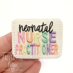 May include: A white felt patch with a rainbow embroidered design that reads "neonatal nurse practitioner".