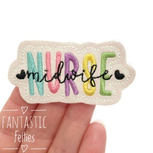 May include: A white felt patch with the word "NURSE" in rainbow colors and the word "midwife" in black script below. The patch has a white sparkly background and a black heart on each side of the word "midwife".