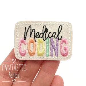 May include: White felt patch with a rainbow embroidered word "CODING" and the word "Medical" in black above it.