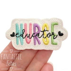 May include: A white felt patch with the word "NURSE" in rainbow colors and the word "educator" in black script below. The patch is surrounded by a white border with a scalloped edge.
