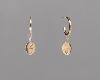 Stacking hoops, huggies, silver or gold-plated, good luck, Tiny Elemental Charm Hoop Earring from the Springs Collection by Haley Lebeuf