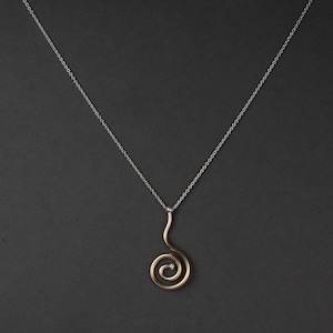 May include: A set of three ceramic mugs with a speckled, matte finish. The mugs are in shades of cream, light gray, and dark gray. Each mug has a simple, minimalist design, perfect for coffee or tea.