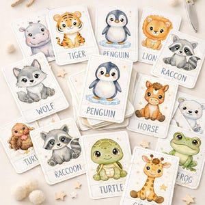 Puede incluir: Un conjunto de 45 tarjetas didácticas de animales con ilustraciones de animales como un tigre, un pingüino y una jirafa. Cada tarjeta está etiquetada con el nombre del animal, diseñada para fines educativos. Las palabras "Cute Educational Flashcards" están en la parte superior.