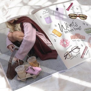 May include: A magazine spread featuring a photograph of a person with a brown handbag and iced coffee, alongside an illustrated guide titled What's in her bag? showcasing items like sunglasses, a hair claw, scrunchie, reading glasses, and cosmetics.