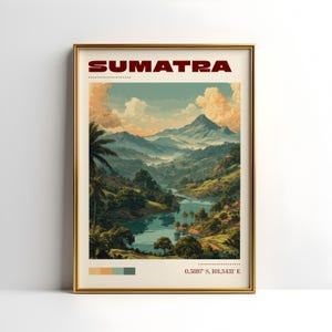 May include: A framed art print depicting a landscape of Sumatra. The image shows a river flowing through green hills and mountains under a cloudy sky. The word "SUMATRA" is printed in red at the top of the print.