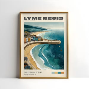 May include: A framed art print featuring a coastal scene of Lyme Regis, with the text "LYME REGIS" at the top. The artwork depicts a beach, buildings, and the sea in shades of blue, beige, and brown. The text "THE PEARL OF DORSET" is at the bottom.