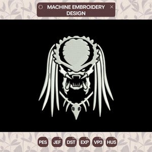 May include: A white machine embroidery design featuring the stylized head of a creature with long dreadlocks, sharp teeth, and a skull-shaped pendant. The text MACHINE EMBROIDERY DESIGN is at the top, with file formats PES, JEF, DST, EXP, VP3, and HUS below.