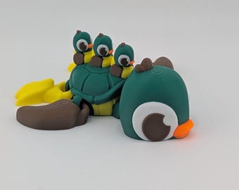 Juguete antiestrés articulado con forma de pato y tortuga – Impreso en 3D con patitos bebés, fabricado en Texas.