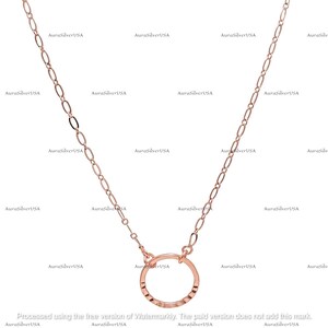 May include: Rose gold necklace featuring a delicate chain and a hammered open circle pendant. The necklace is a simple, elegant design suitable for everyday wear. The chain length is approximately 18 inches.