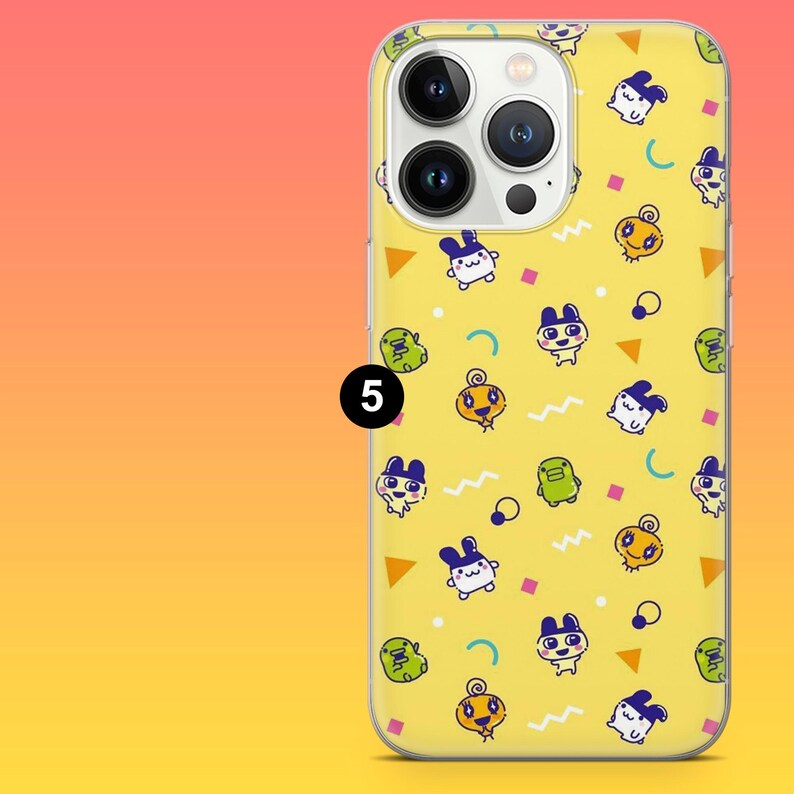 May include: Yellow phone case with a repeating pattern of cartoon characters in various colors. The case has a clear border and a camera cutout. The number 5 is printed on the case.
