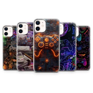 May include: Five phone cases with gaming-themed designs. The cases feature colorful graphics of game controllers, consoles, and retro gaming elements. The color palette includes neon green, purple, orange, and black. The cases are designed for a smartphone.