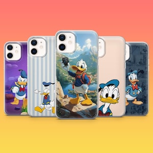 May include: A collection of five phone cases featuring Donald Duck designs. The cases showcase various scenes, including Donald Duck with a camera, against a mountain backdrop, and in other cartoon settings. The cases have a glossy finish and are displayed on a gradient background.